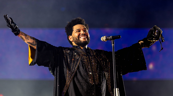 Man on stage performing