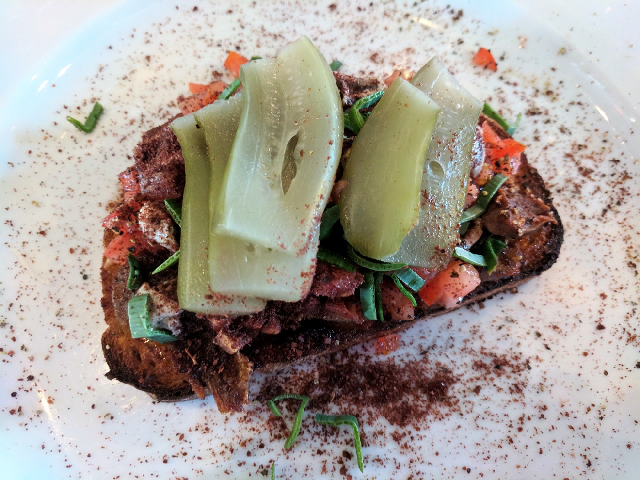Lamb tongue crostini with Israeli-style pickles at Canary by Gorji.