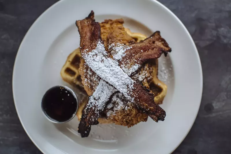 Image: The Texas-shaped waffle is topped with fried chicken, bacon and powdered sugar.