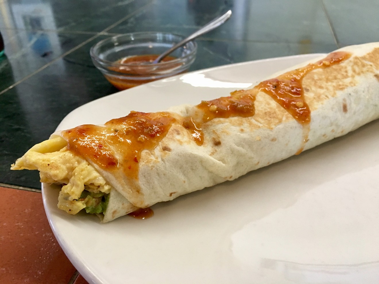 La Victoria's Don's Delight breakfast burrito is named after a longtime patron and filled with scrambled eggs, bacon, guacamole and onion.