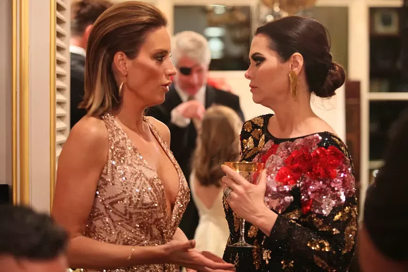 Image: D'Andra Simmons and Cary Deuber talking. Maybe about private information?