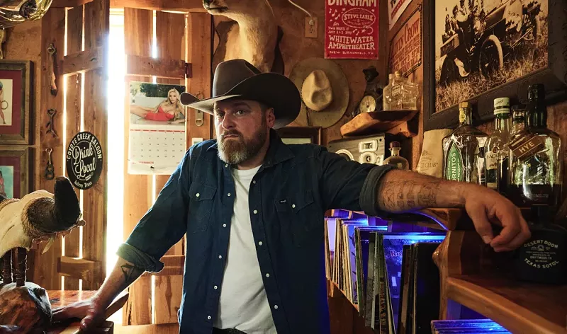 Image: Man with cowboy hat posing