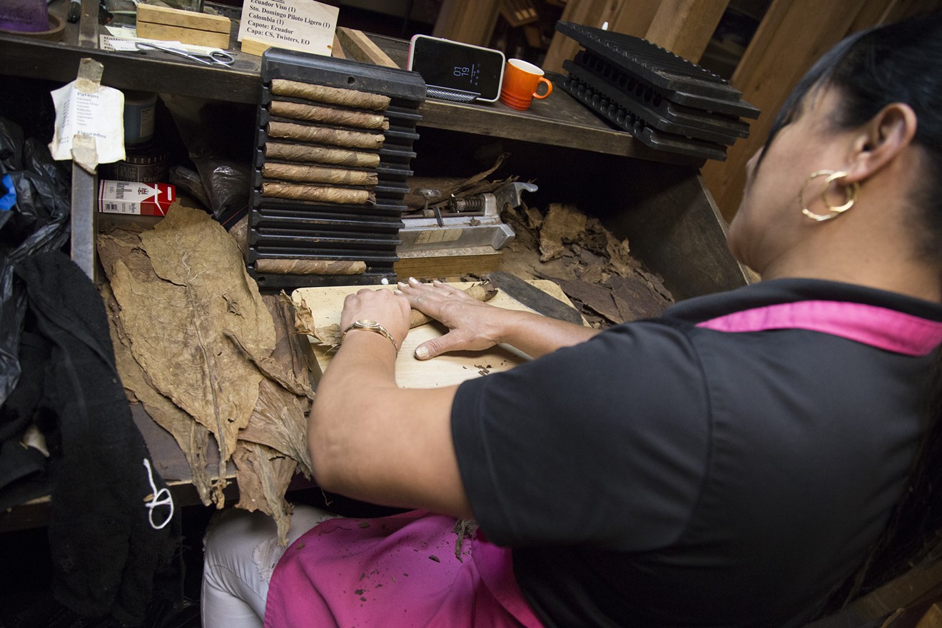 Inaluis Dominguez rolls cigars in-house at House of Cigars Factory. The store sells only custom-made, house-rolled cigars designed by owner Willie Martinez. Martinez says the special blends are what make House of Cigars Factory unique.