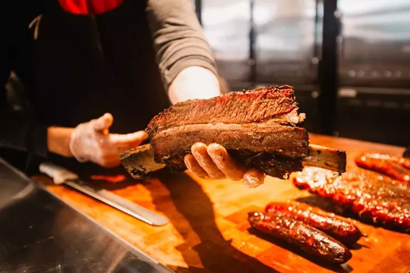Image: The meat cutters at Terry Black's are knowledgable and accommodating when you'd like a beef rib photo to impress your Instagram followers.