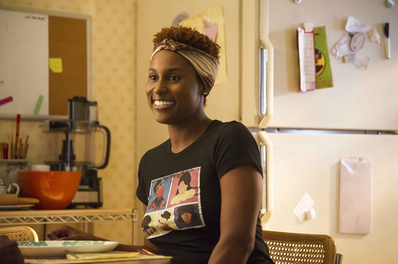 Issa Rae, seen here in a still from Insecure, has one of the funniest memoirs we've ever read.