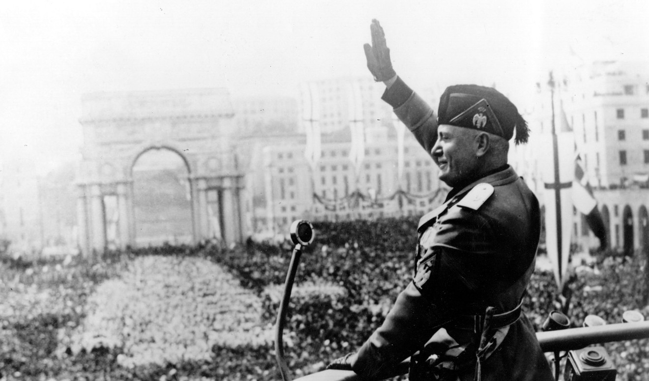 Italian dictator Benito Mussolini waving at a crowd. Dallas filmmaker Guy Mayfield says he's the only person to know the truth about his death.