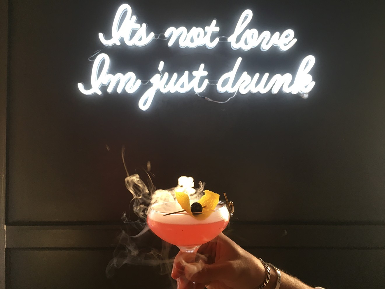 Give us a cocktail and we're happy. Give us a cocktail and a neon sign, and we're never leaving.