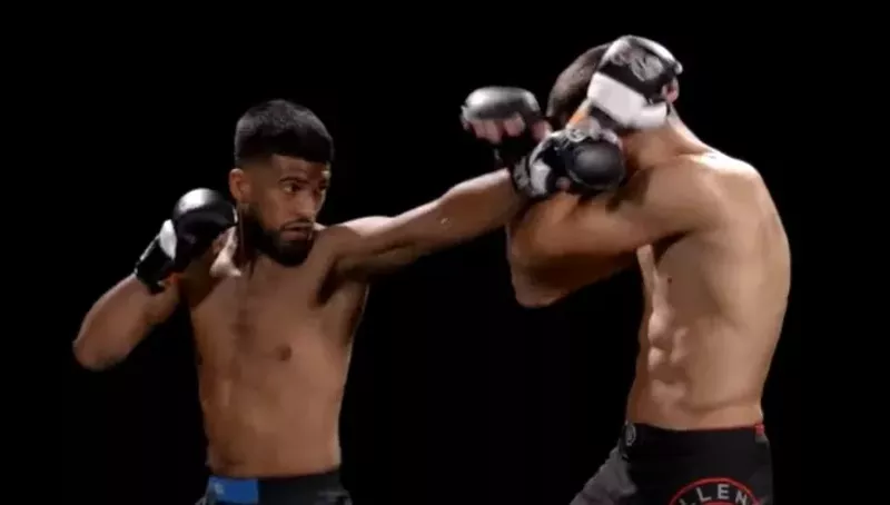 Image: Two fighters demonstrate a spinning back fist in an instructional video for triad combat, a new, full contact fighting sport that will make its debut at Globe Life Field on Saturday, Nov. 27.