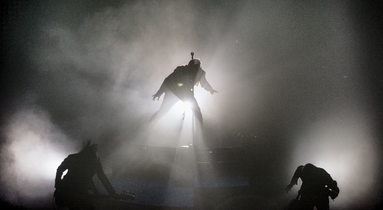 As a venue, Verizon Theater wasn't very conducive to the mysterious vibe the band was trying to create with the fog. Security guards walked around like the Gestapo with tiny flashlights, illuminating concert goers.