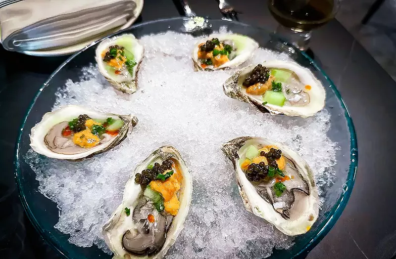 Image: The House Royal Oysters are topped with a bit of caviar.