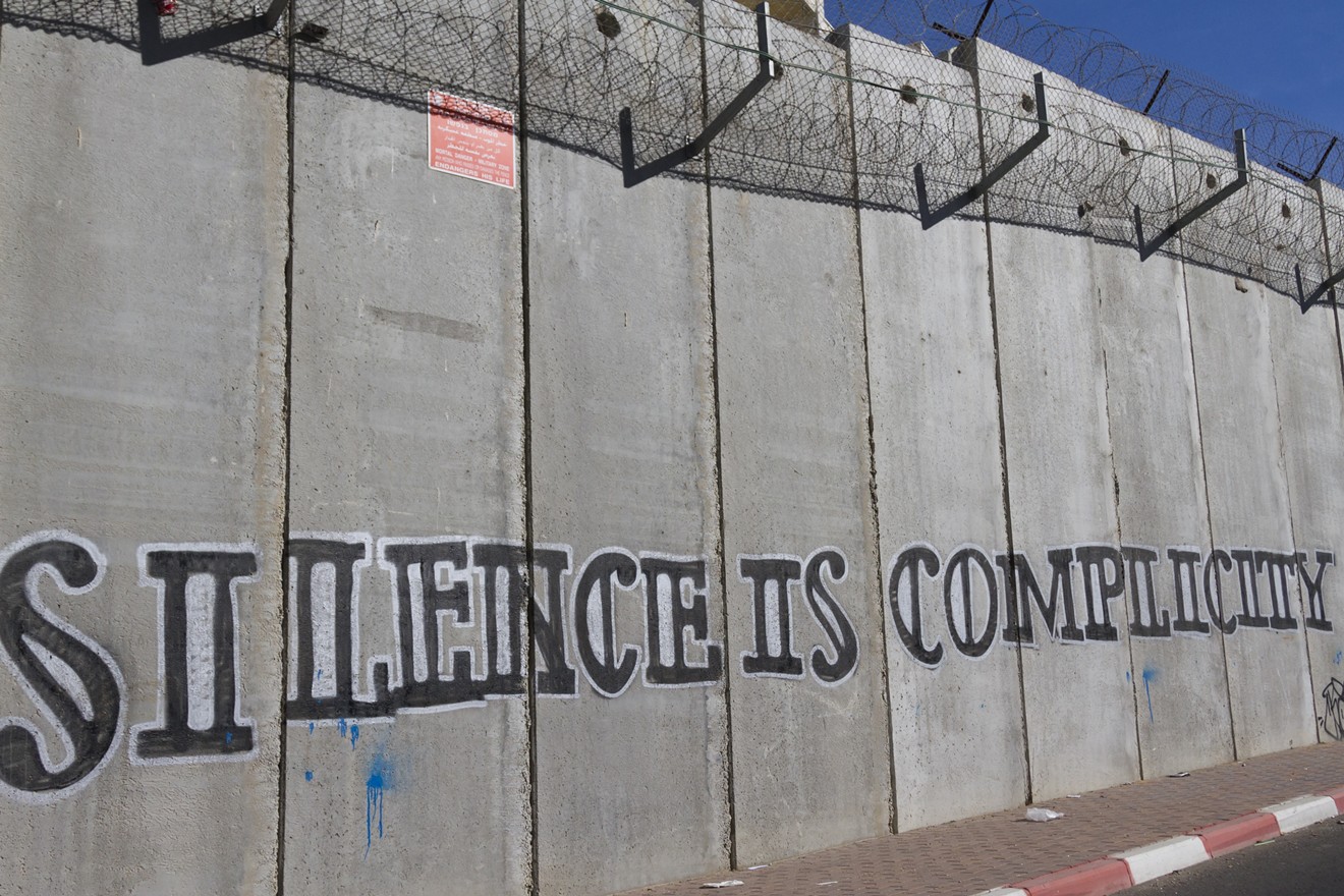 The wall between the West Bank and East Jerusalem — in Texas, silence is also golden when it comes to criticizing Israel.
