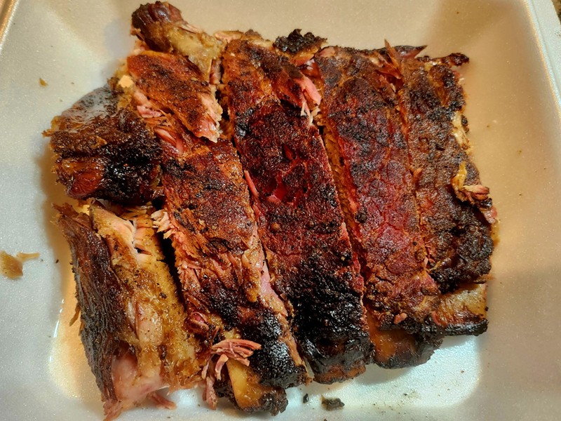 A pound of pristinely smoked pork ribs.