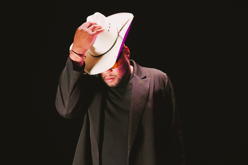 Image: Man with a hat in a suit