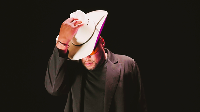 Man with a hat in a suit