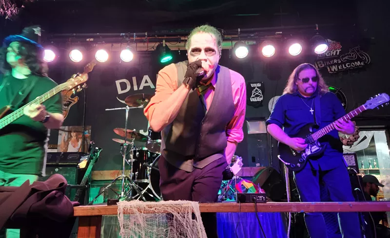 Image: The Black Sabbath and Ozzy Osborne tribute band Iron Mang performing a set at Diamond Jim's Saloon in Arlington