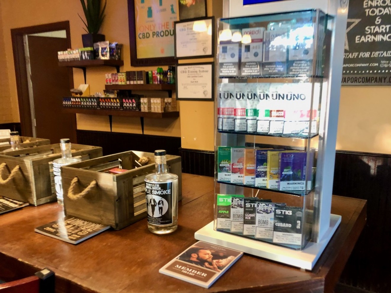 Disposable vaping devices on display at Artisan Vapor & CBD in Dallas