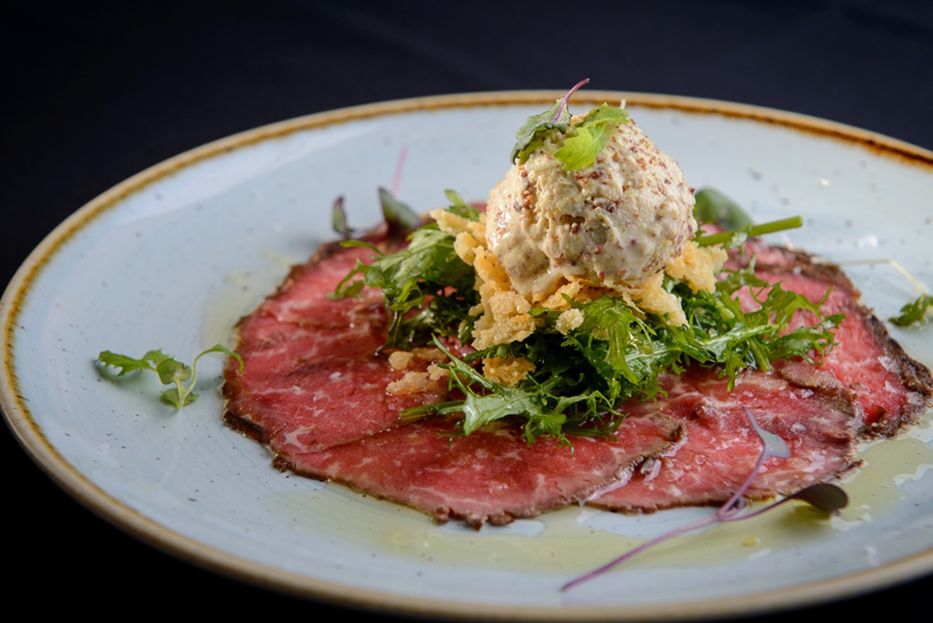 Beef carpaccio topped with mustard ice cream (yes, ice cream)