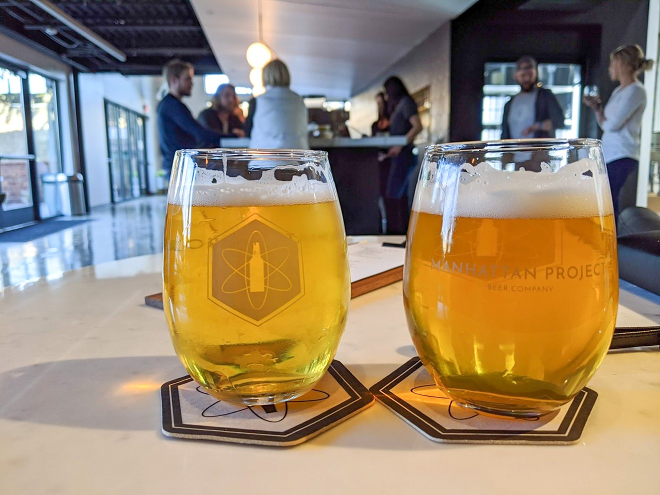 Two beers at Manhattan Project: X-10 session ale and Reaction dry-hopped saison