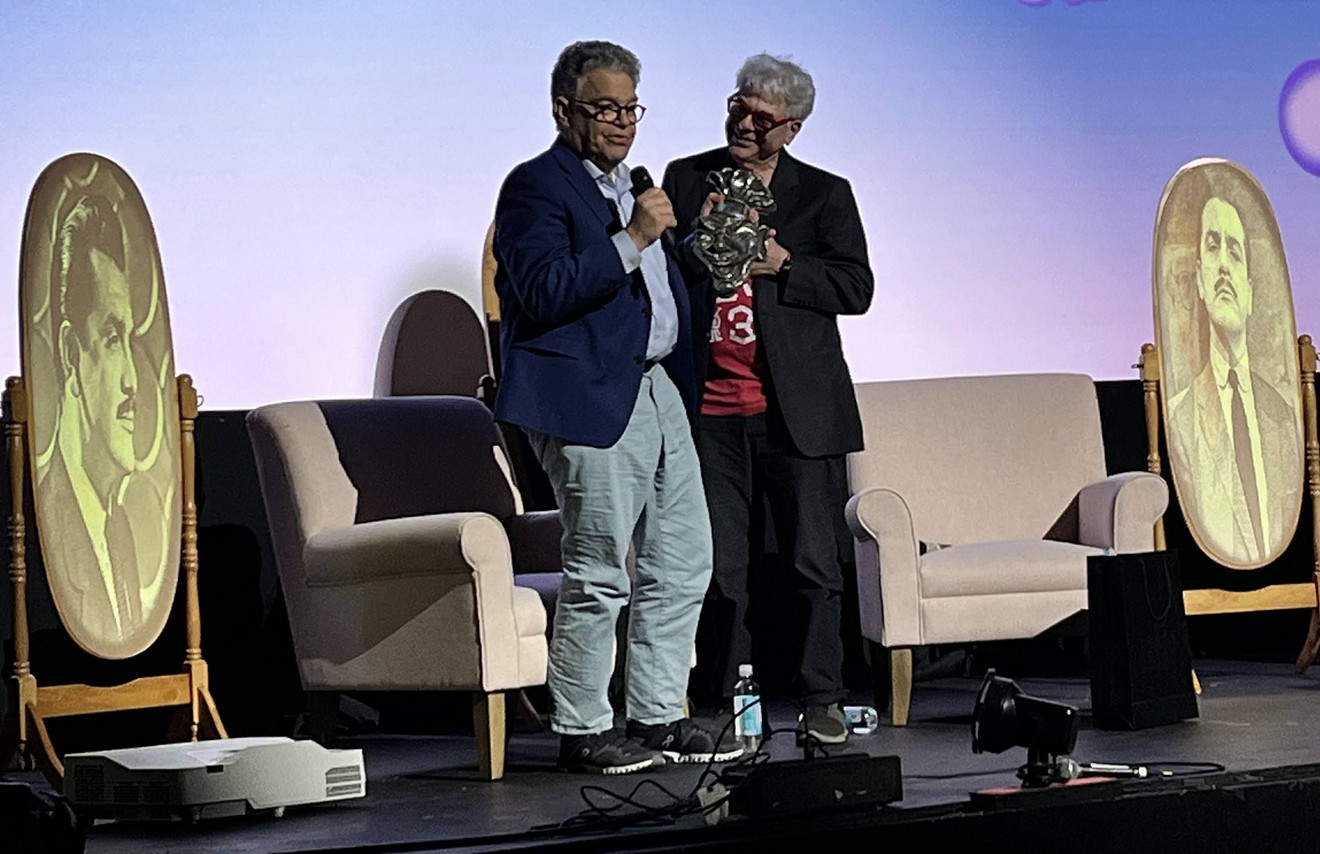 U.S. Senator and comedian Al Franken, left, accepts the Ernie Kovacs Award from VideoFest founder Bart Weiss on Thursday at the Texas Theatre in Oak Cliff.