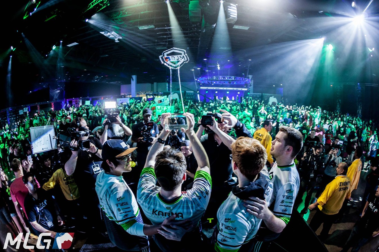 Members of the OpTic Gaming team hoist their championship trophy after the team's big win at the 2017 Call of Duty World League in Orlando, Florida.