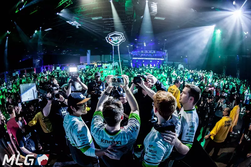 Image: Members of the OpTic Gaming team hoist their championship trophy after the team's big win at the 2017 Call of Duty World League in Orlando, Florida.