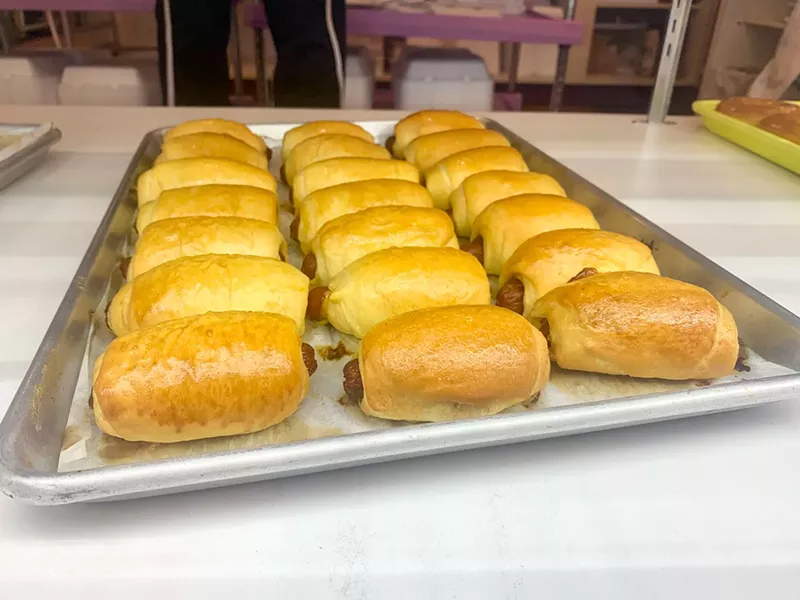 Image: Sausage rolls are about 12 bucks per dozen at Jarams, where cheese is woven into the dough.