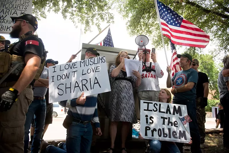 Image: Protestors gathered to march against Sharia in Richardson outside the Islamic Association of North Texas.