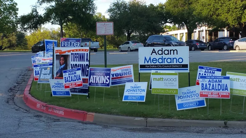 Image: Campaign signs abound outside Reverchon Park in Oak Lawn.