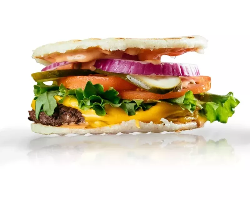 Image: Behold, Arepa TX's arepa burger, in all its nontraditional bun glory.