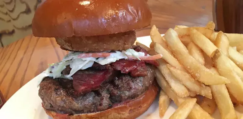 Image: The strange construction of the burger at the Crescent’s Conservatory, with a side of fries and a couple of perfunctory pickles for $26.