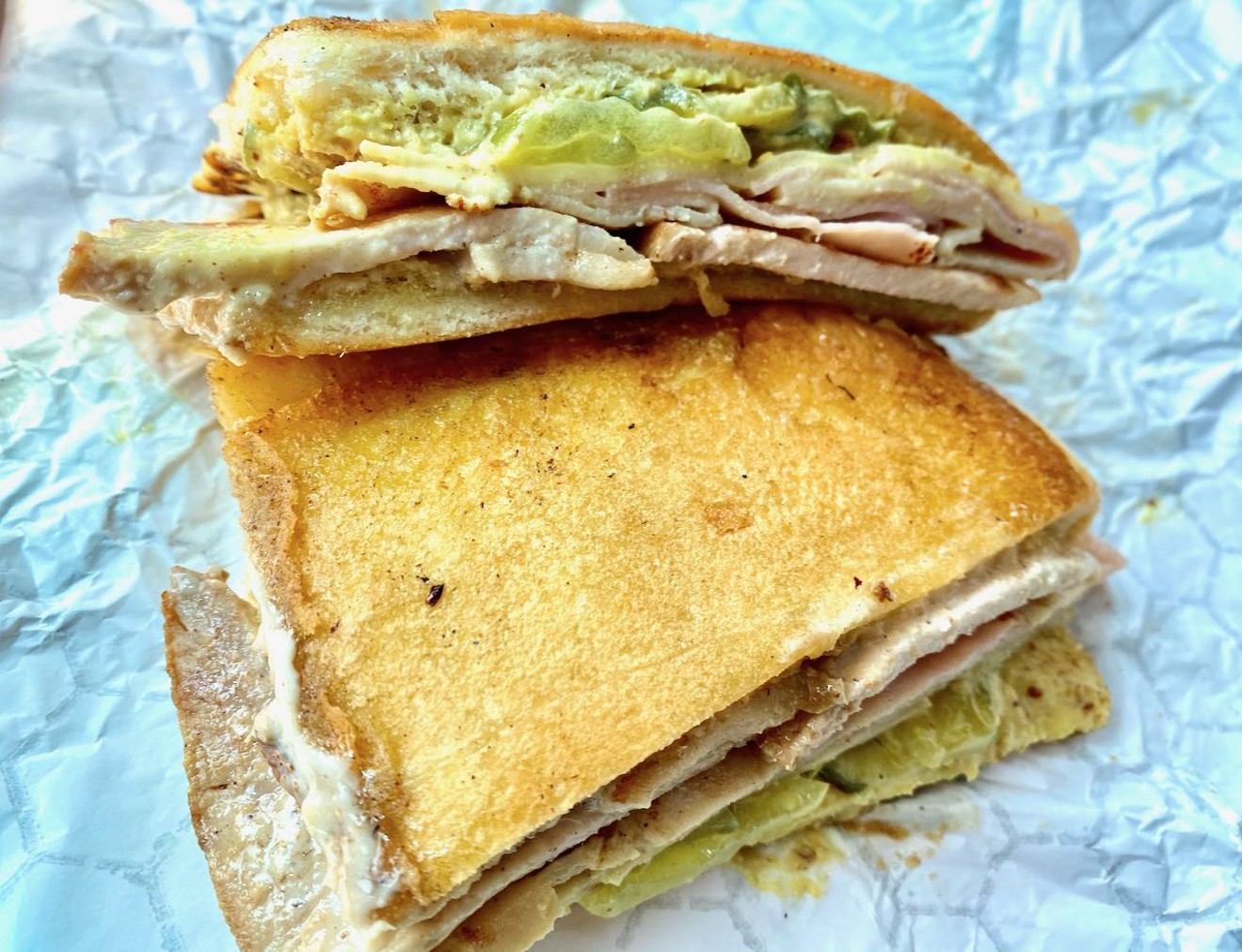 That bread gets a workout trying to contain the Puerto Rican Tripleta at Colossal Sandwich Shop.