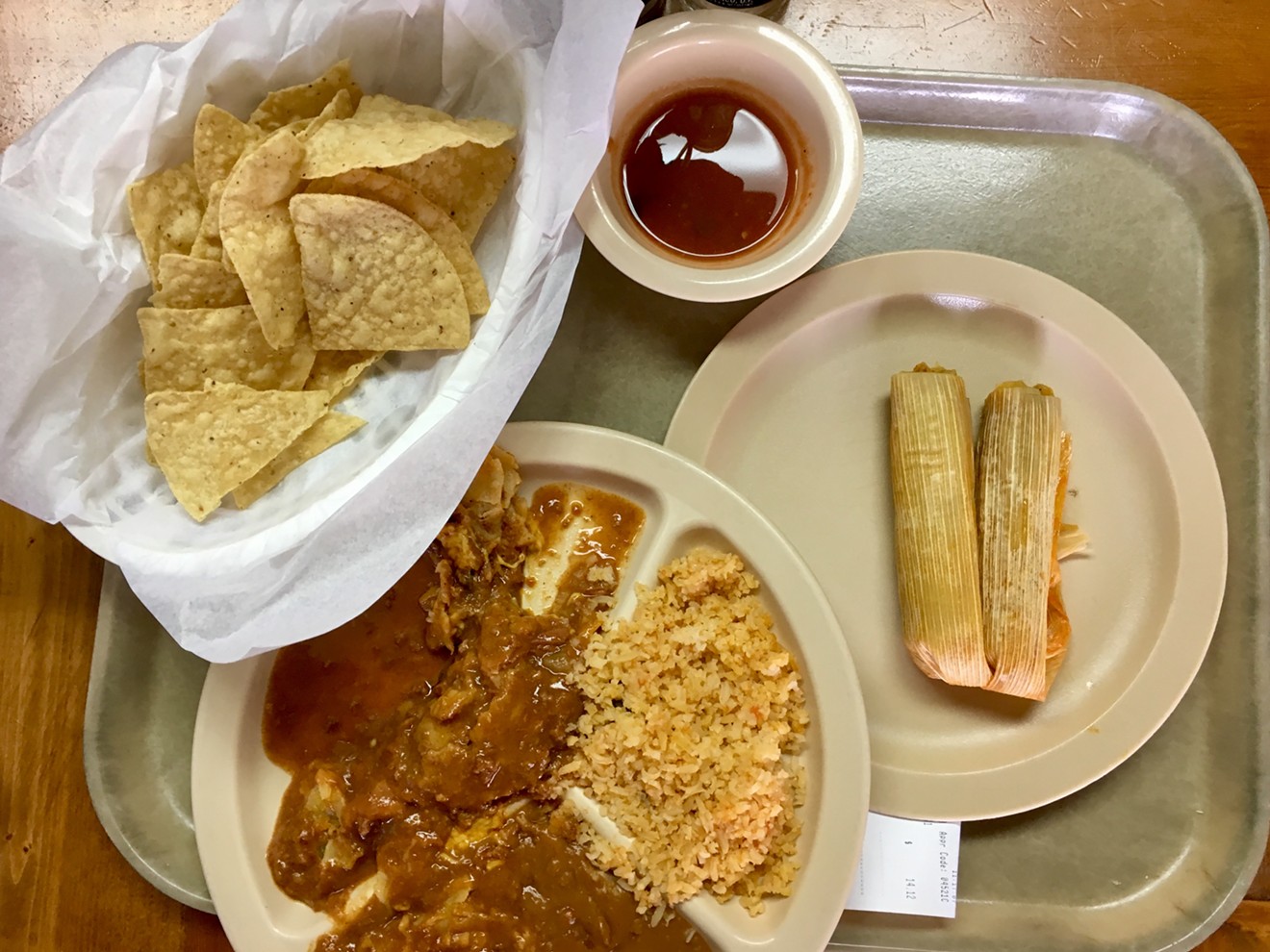 Morning tamales and salsa in a paper cup at the all-you-can-eat cafeteria.