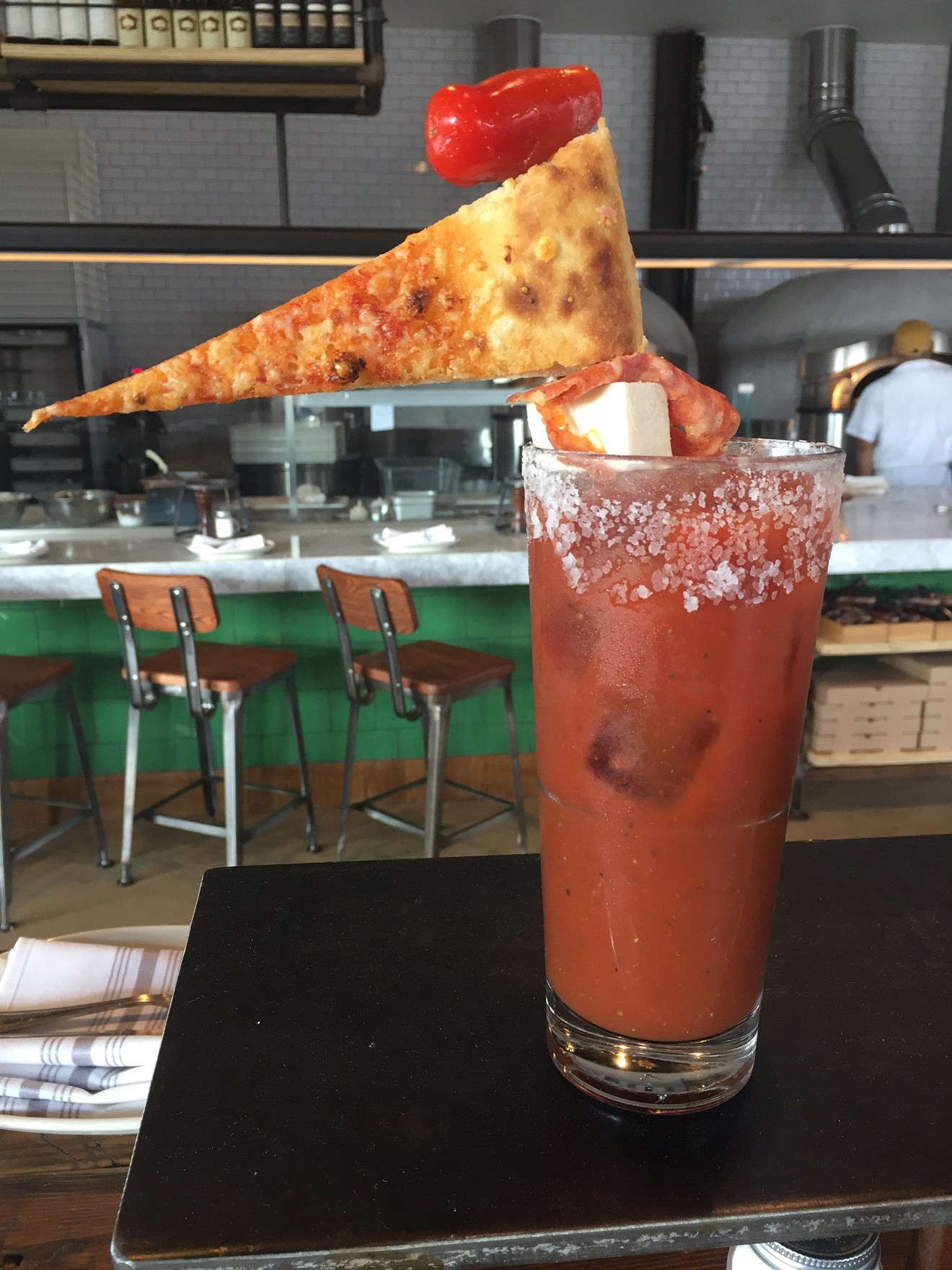 They do pizza so well, they even put a slice on their drinks.
