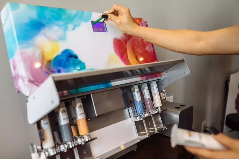 Image: With its containers of dye and automated screen, the DreaMàu device looks a lot like a miniature version of a paint mixer you’d find at the hardware store.