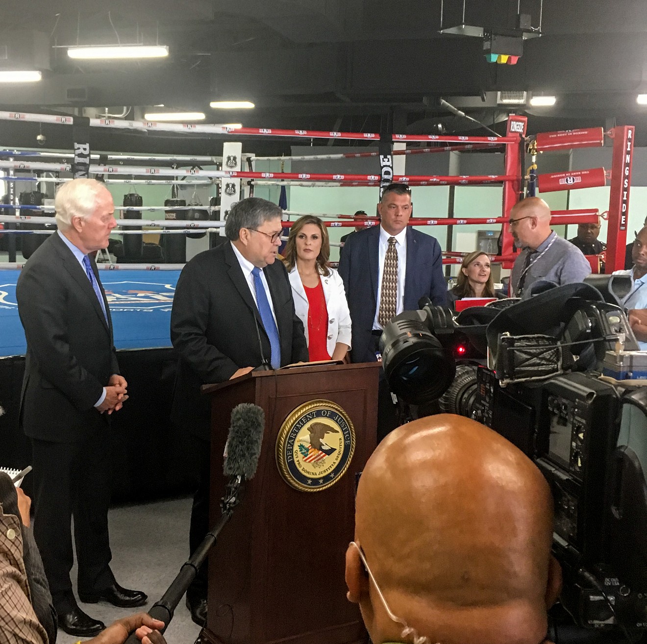 Senator John Cornyn and U.S. Attorney General William Barr take questions at the North Lake Highlands Youth Boxing Gym, where they spoke about a safe neighborhoods initiative.