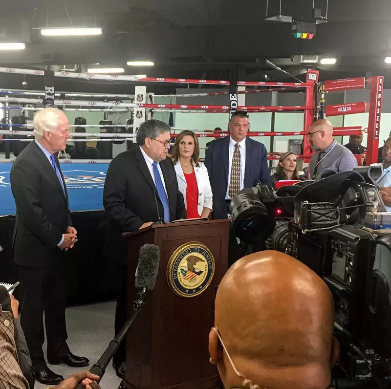 Image: Senator John Cornyn and U.S. Attorney General William Barr take questions at the North Lake Highlands Youth Boxing Gym, where they spoke about a safe neighborhoods initiative.
