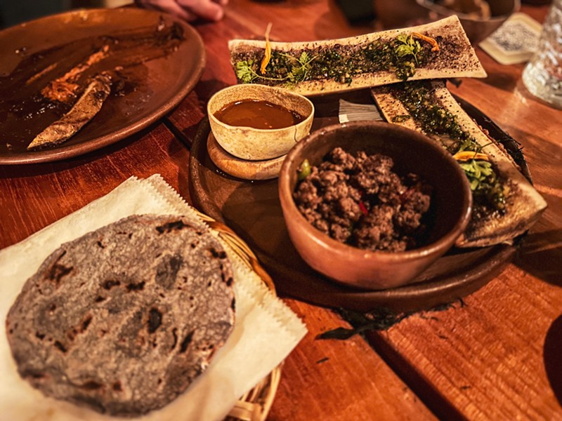 Tuetano comes with two servings of bone marrow topped with chimichurri, with diced ribeye and homemade tortillas.