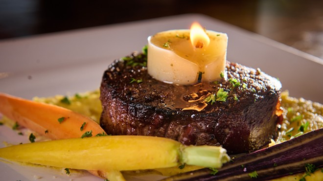 A tallow candle melts into a filet at Beckley 1115.