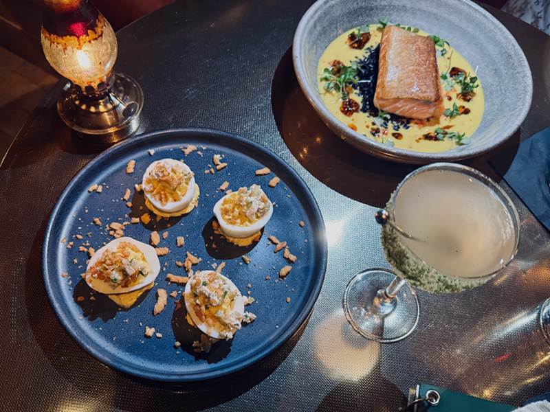 Image: A quartet of Dirty Martini Devilved Eggs pairs perfectly with a dirty martini at Apothecary.