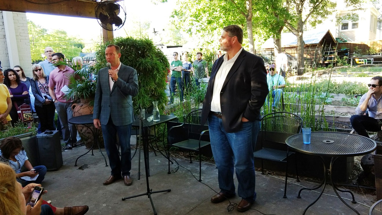 Philip Kingston, left, and Matt Wood, debating at The Garden Cafe on Junius in East Dallas last Sunday evening.