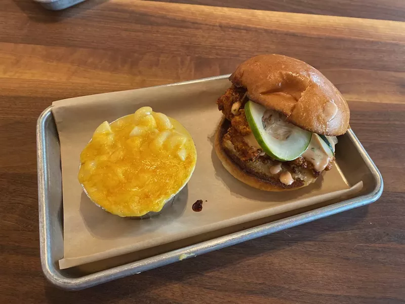 Image: A Southern fare plate of mac and cheese along with a hot chicken sandwich.