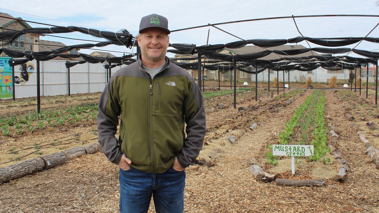 Daron Babcock stands in front of "the big farm," where he grows and sells produce to the South Dallas neighborhood and also to Dallas chefs.