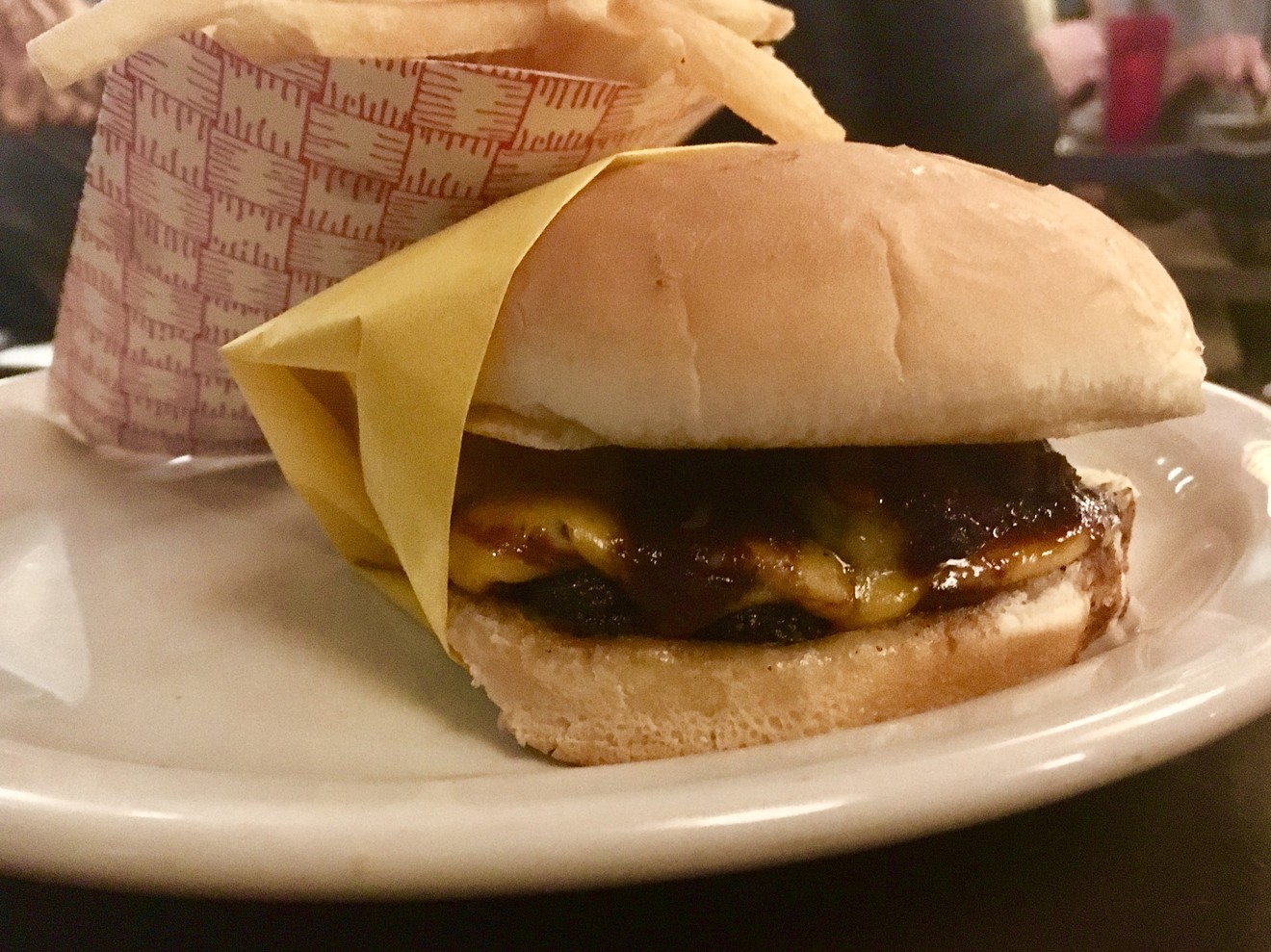 The Thick and Morty cheeseburger, topped with an in-house version of A1 sauce, served in Whataburger yellow for $13 (with fries).