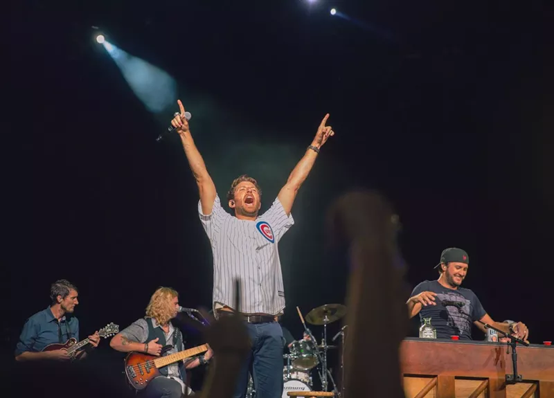 Image: Brett Eldredge is center stage, with headliner Luke Bryan tending bar.
