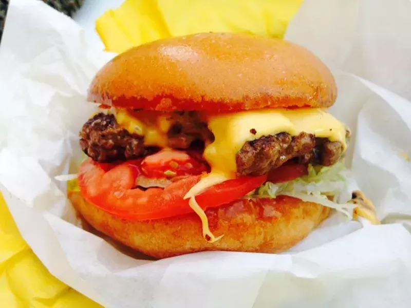 Image: Behold the griddled crust of a simple, classic cheeseburger with American cheese.