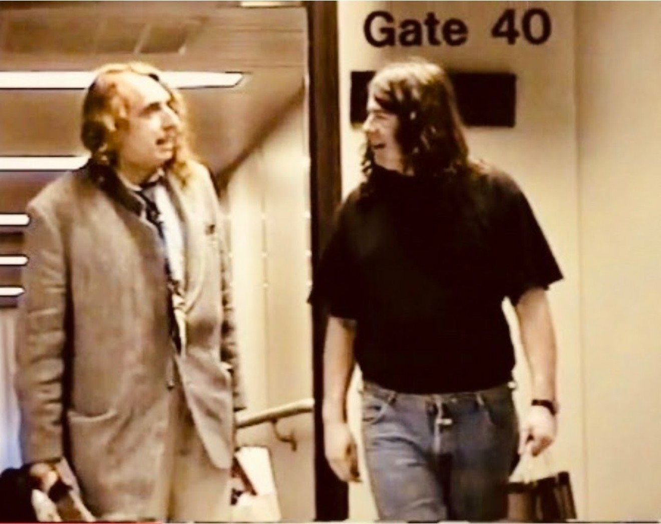 Bucks Burnett (right) picks up legendary musician Tiny Tim (left) at the airport in 1990 for one of Tiny's many concerts in North Texas. Burnett managed Tiny's career for the final third period of the pop star's career.