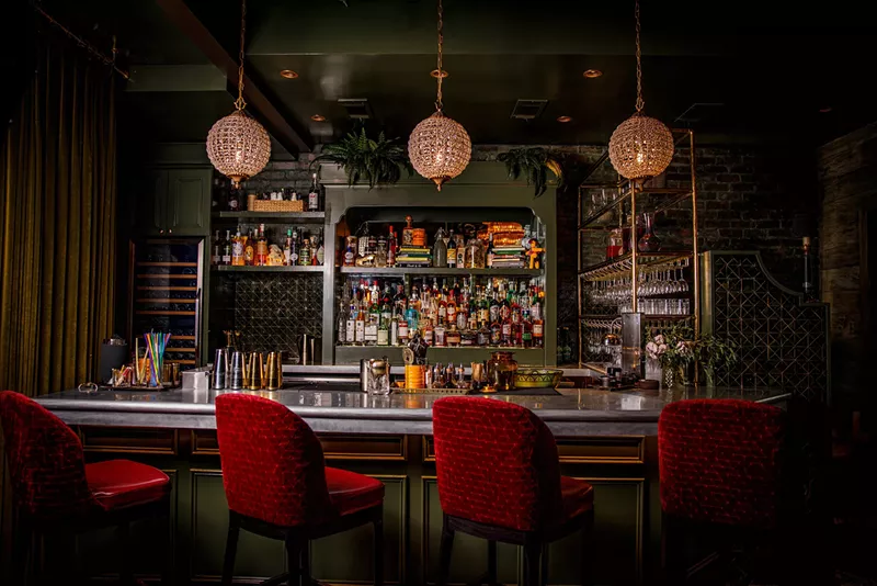 Image: Velvet, brass, and a little Bourbon Street mystery—Caché is a whole mood.