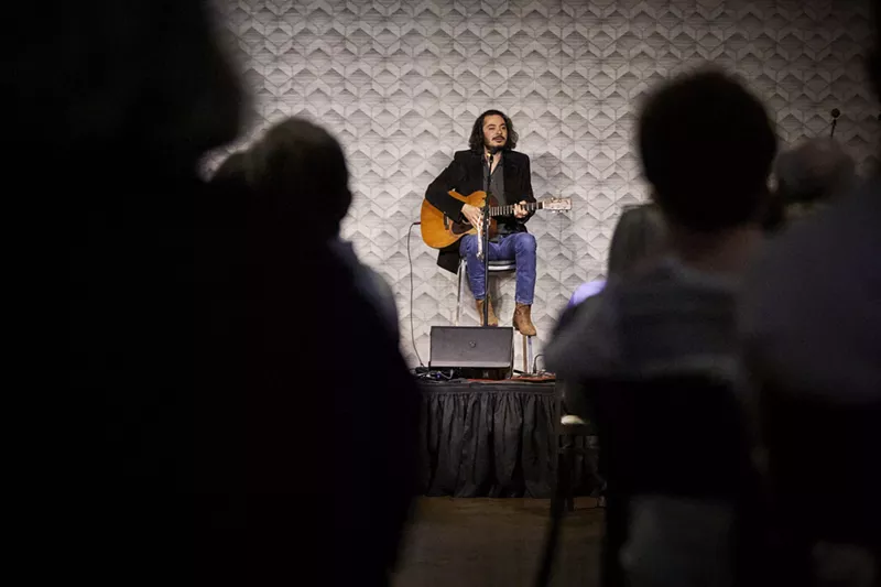 Image: Singer Max Gomez performs at Café Momentum's monthly Sunday Supper series.