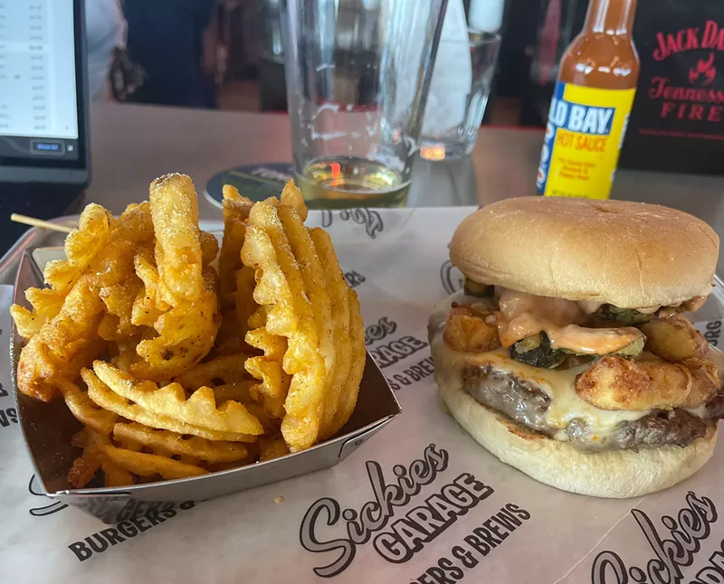 Image: The County Fair Burger comes with cheese curds, jalapenos, cheese and a house sauce,