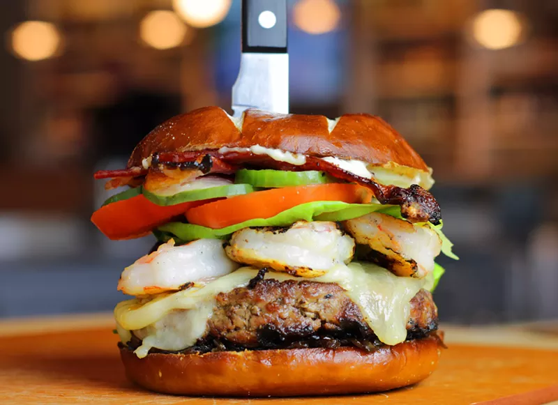 Image: The Yacht Club Burger at TJ's Seafood with the "surf and turf" option of grilled shrimp.
